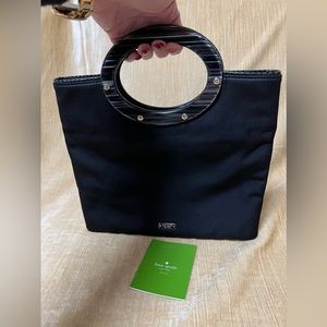 KATE SPADE NWOT JOYCELYN MARBLED TOP HANDLE FOLDABLE NYLON CLUTCH WITH DUST BAG.